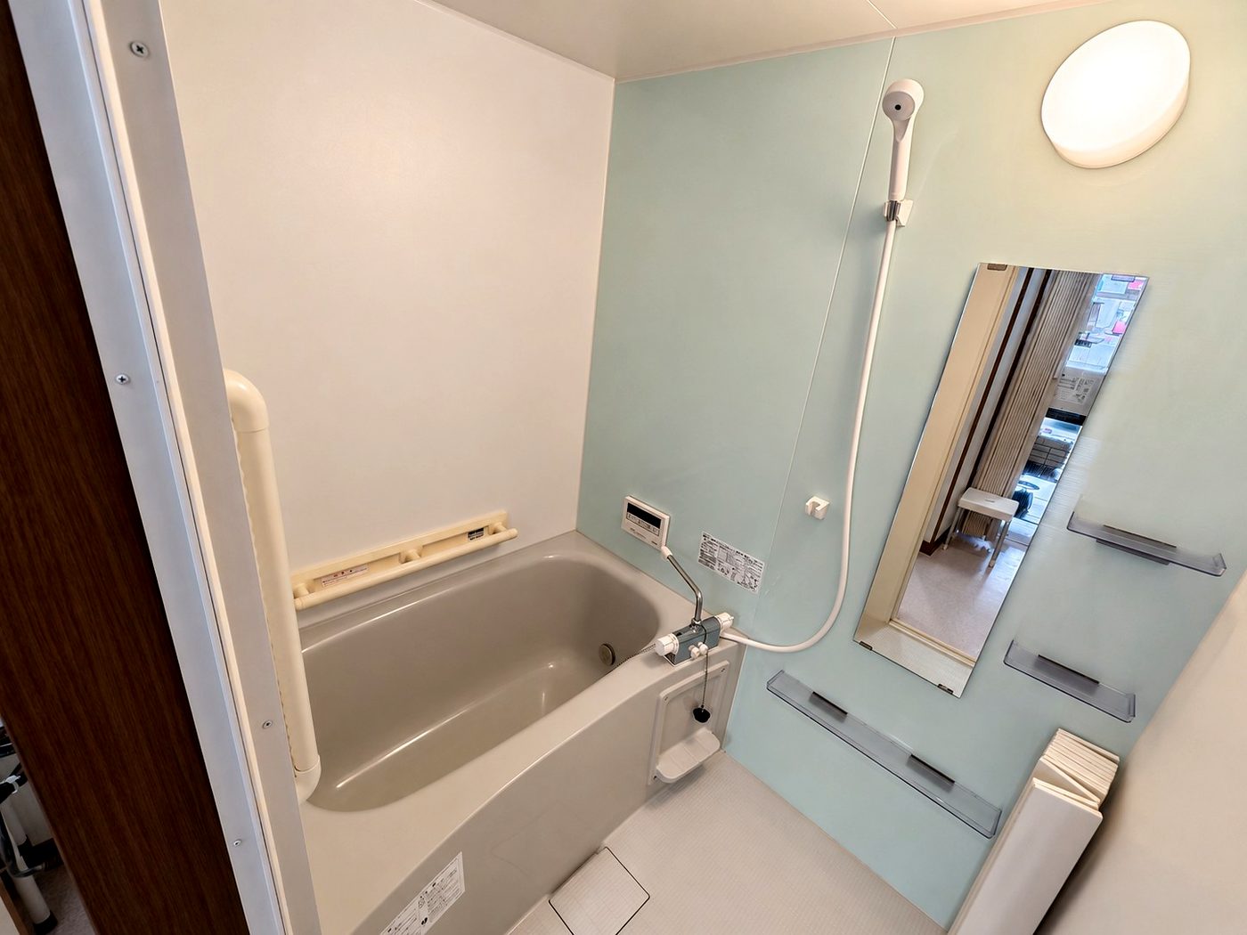 Bathroom with bathtub and shower